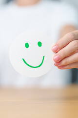 Woman show Happy Smile face paper, Mental health Assessment, Psychology, Health Wellness, Feedback, Customer Review, Experience, Satisfaction Survey, Positive Thinking and World Mental Health day