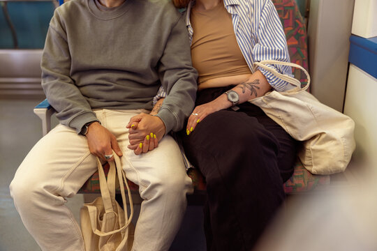 Close up of tourist couple is travel together while riding in public bus . High quality photo