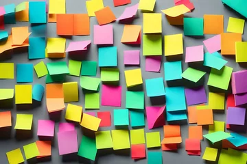 Zelfklevend Fotobehang A set of colorful post-it tabs and page markers sticking out of a book © Muhammad