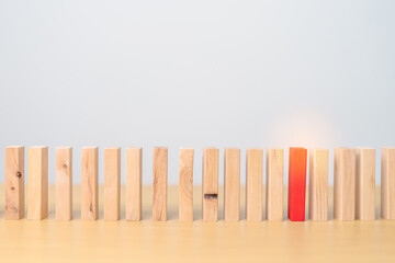 Red domino wooden block on table. Business planning, Risk Management, Solution, leader, strategy, different, Hiring, Human Resource and Unique Concepts