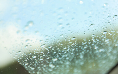 Raindrops on window, a poetic embrace of solitude and renewal. Symbolizes nature's teardrops...