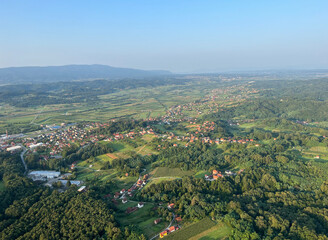 Obraz premium View of forests, fields, villages and Zagorje hills, during a panoramic balloon flight over Croatian Zagorje - Croatia (Panoramski let balonom iznad Hrvatskog zagorja - Hrvatska)