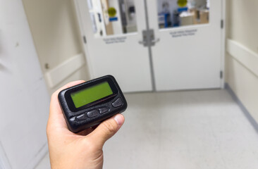 Pager's presence signifies instant connection: modern communication's emblem, bridging distances,...