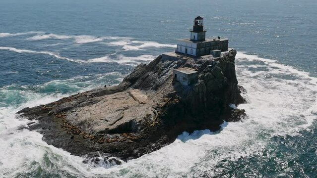 Lighthouse on Island Off Coast Aerial Footage Drone Shot of Remote Light House