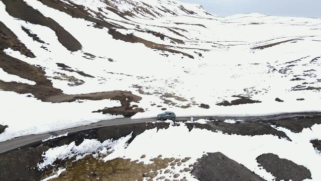 aerial snowy landscape of jeep driving on Komic  district of Himachal Pradesh World's Highest Village india