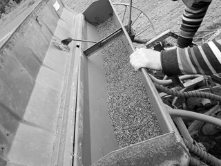 Plowed field by tractor in black soil on open countryside nature