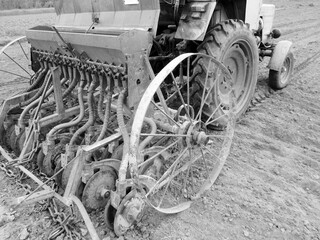 Plowed field by tractor in black soil on open countryside nature