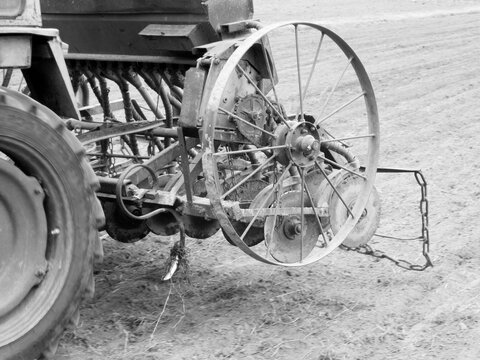 Plowed field by tractor in black soil on open countryside nature - Powered by Adobe