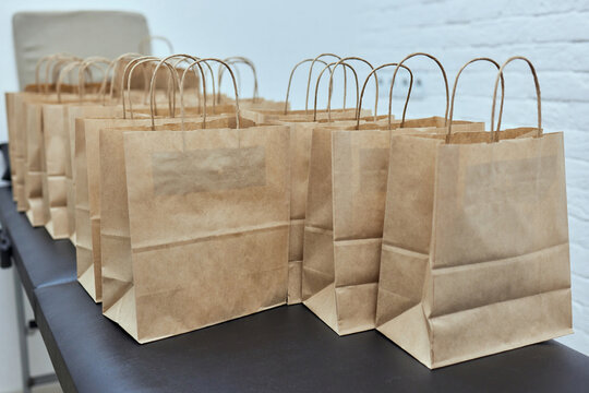 Dessert Paper Bag Waiting For Customer On Counter In Modern Cafe Coffee Shop, Food Delivery, Cafe Restaurant, Takeaway Food.