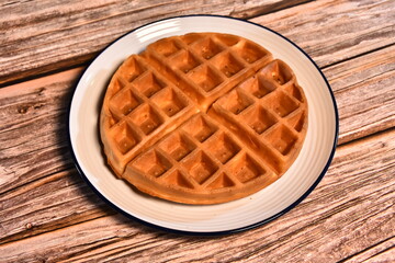 Waffle and wooden blackground