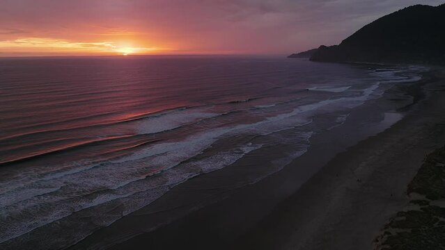 Ocean Sunset Drone Establishing Opening Scene of Waves at Sunrise Coastal Village 