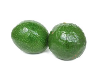 Fresh organic avocado laying on white background.