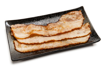 フライパンで焼いた薄切りベーコン