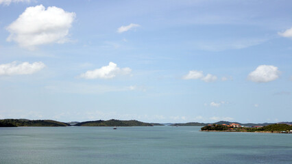 Beautiful view of sea and island with sunny clouds