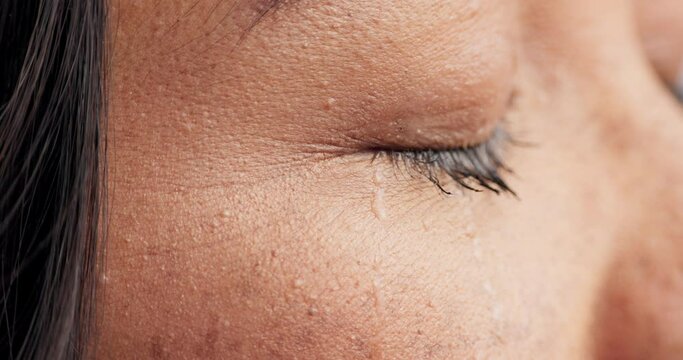 Crying, eyes and sad woman closeup with depression, mistake or mental health crisis, trauma or fear. Zoom, tears and face of female person with anxiety, stress or broken heart, grief and fail regret