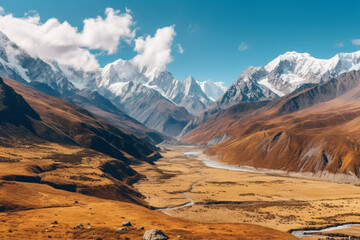 Beautiful mountain landscape with snow-capped peaks and valley.