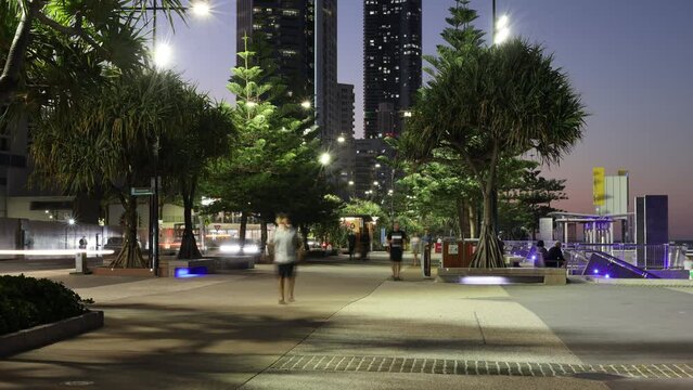 Time lapse of people walking around on the beach at night in Surfer Paradise, Queensland, Australia.