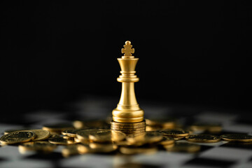 Stack of Coins with the Golden Chess character to represent It's time to do money saving for retirement planning as concept.