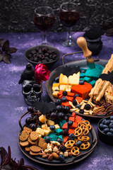 Halloween appetizers. Cheese plate with snacks