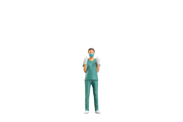 Miniature people young doctor in scrubs Isolated on white background with clipping path