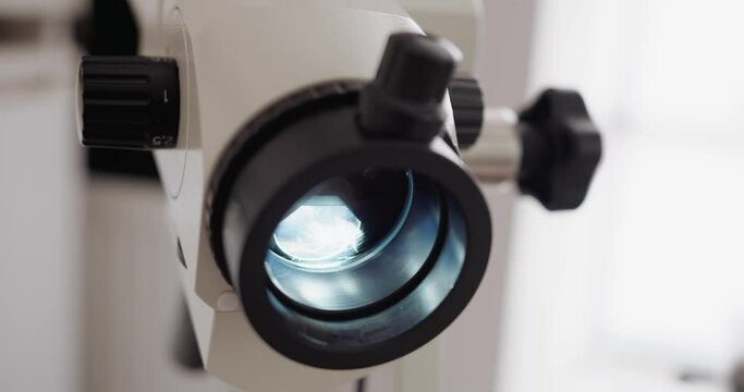 Closeup of colposcope in gynecologist's cabinet at clinic. Optical microscope device for the diagnosis and examination of the vagina, cervix. Obstetrics and gynecology women's health.