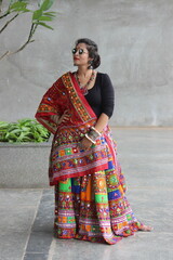 beautiful indian woman wearing red and black chaniya choli with multicolor ghaghra and fabric...