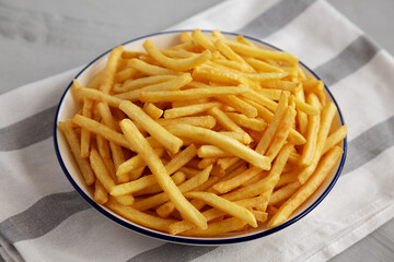 Homemade French Fries on a Plate, side view.