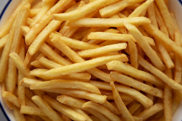 Homemade French Fries on a Plate, top view. Flat lay, overhead, from above. Close-up.
