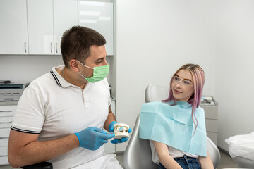 Fototapeta na wymiar examination of a dentist treating a female patient who came to him with complaints.