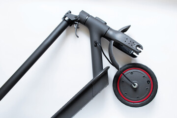 Disassembled electric scooter, wheel puncture and replacement with a new wheel, electric transport repair