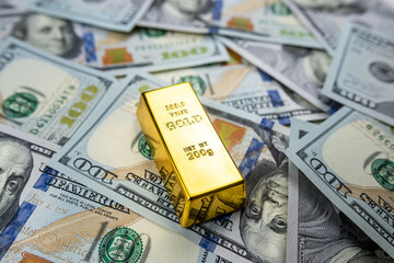 Paper us money with gold bars, saving and investment wealth