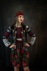 Obraz na płótnie Canvas Portrait of beautiful caucasian ukrainian young woman wear red embroidered dress, vyshyvanka