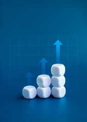 Higher arrows on white blocks business chart steps isolated on blue background with graph line table. The business growth graph process, goal, success, and economic improvement and analysis concepts.