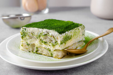 Matcha Tiramisu, Italian Tiramisu Cake with Matcha Green Tea on Concrete Background