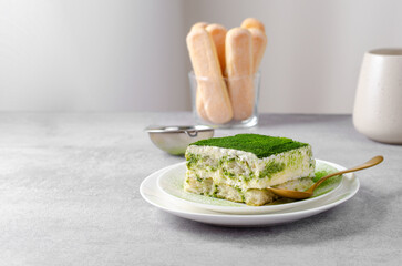 Matcha Tiramisu, Italian Tiramisu Cake with Matcha Green Tea on Concrete Background