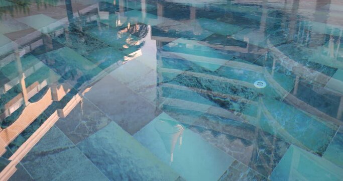 Reflections of hotel building in water of pool with blue tiles at sunset. Concept of resort area and place for swimming slow motion