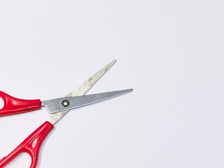 Top view red scissors isolated on white background.