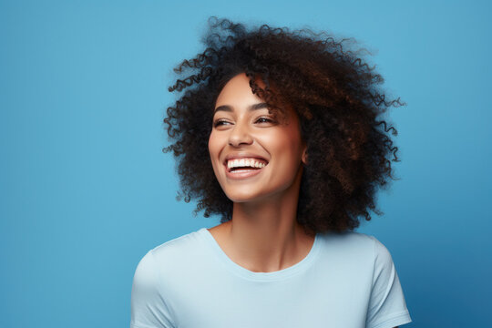 Portrait Of A Woman Smiling Looking To The Side Black Woman Blue Background