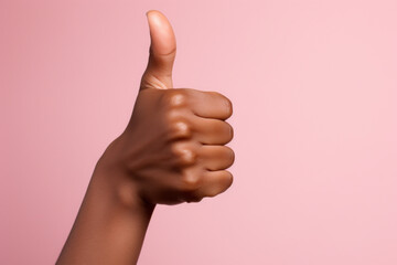 Hand Showing Thumbs Up Black Hand Pink Background