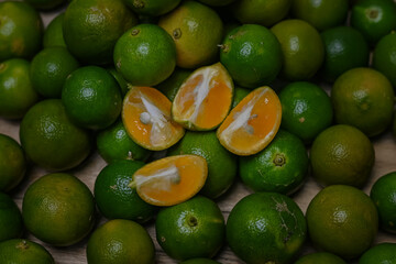 Calamansi oranges on wooden background