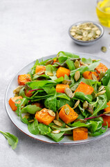 Pumpkin Salad with Arugula and Pumpkin Seeds, Salad Mix with Roasted Pumpkin, Fresh Vegan Autumn Salad