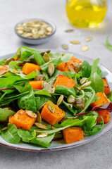 Pumpkin Salad with Arugula and Pumpkin Seeds, Salad Mix with Roasted Pumpkin, Fresh Vegan Autumn Salad