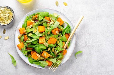 Pumpkin Salad with Arugula and Pumpkin Seeds, Salad Mix with Roasted Pumpkin, Fresh Vegan Autumn Salad