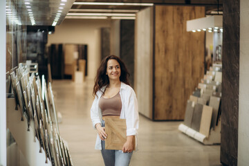 Woman looking for tiles at building market