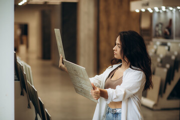Female customer choosing kitchen ceramic tile in store