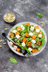 Pumpkin Salad with Arugula, Feta Cheese, and Pumpkin Seeds, Salad Mix with Roasted Pumpkin, Autumn Salad