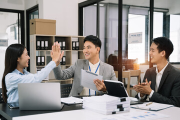 Happy smiling businessman feel happy work complete Teamwork success, success at work in the office concept.