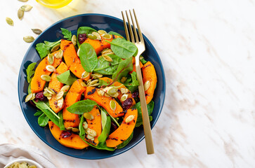 Grilled Pumpkin Salad with Arugula, Spinach, and Pumpkin Seeds, Salad Mix with Roasted Pumpkin, Autumn Salad
