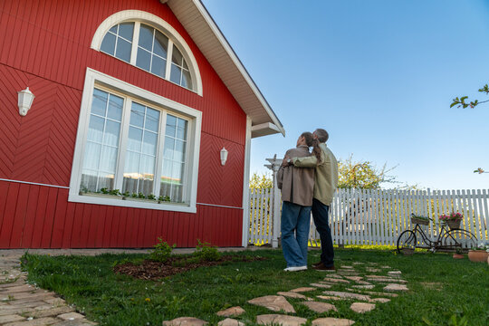 Man and woman admiring house
