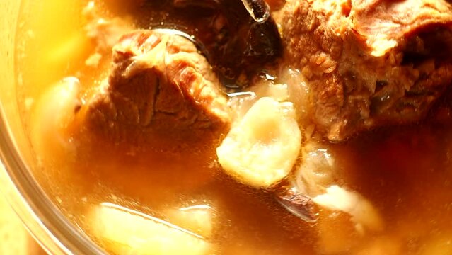 Braised pork  soup in bowl, in door  Chiangmai  Thailand.